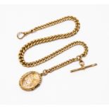 A 9ct gold graduating Albert chain and oval 9 ct back and front locket fob,length approx 13'',