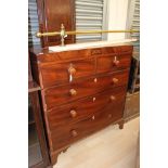 An early Victorian mahogany chest of drawers, comprising two short over three long drawers,