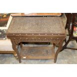 A 19th Century parquetry fold-over games table,