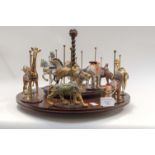 A Franklin Mint Ltd full collection of twelve "Magic of the Merry go Round" figures and stand,