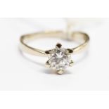 A diamond solitaire 14k white gold ring, the round brilliant-cut diamond weighing approx 1 carat,