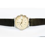 Leonidas, a Leonidas chronograph steel watch, circa 1950, round white dial, domed steel back,