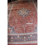 Large red and blue patterned rug