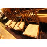 A set of eight 20th Century spindle back chairs, each with drop in seats,