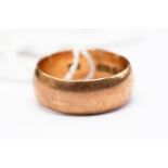 A 9ct rose gold wedding band, width approx 7mm, size S,