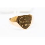 A 9ct gold signet ring, shield shape with engraved detail, size S,