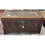 A mid 20th Century chest, carved top, carved front and sides, carved in high relief, 49cm high,