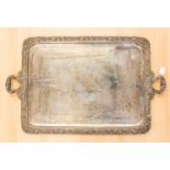 A large silver plated twin handled tray, engraved centre within a leaf and acorn border, 80cm wide.