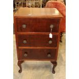 An early 20th Century mahogany chest of drawers, fitted with three short drawers, cabriole legs,