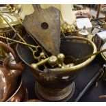 Collection of brassware to include a helmet shaped coal bucket, shovel, pinchers,