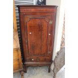 A George III oak floor standing corner cupboard,