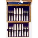 A boxed set of twelve place setting silver fruit knives and forks with mother of pearl handles,