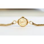 A 9ct gold ladies Rotary watch, with 9ct gold strap, total gross weight approx 14.