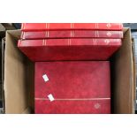 Seven red stamp stock books of GB Mint stamps,