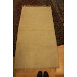 Plain cream medium pile rug