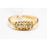 A diamond boat head ring set with five small diamonds, 18ct gold, size N,