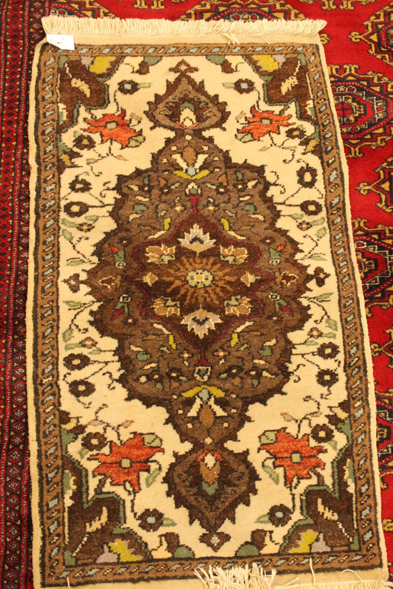 Small green rug with floral pattern