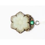 A 19th/20th century Chinese pale jade and silver pendant,