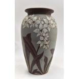 Brown and green ground Langley pottery vase with floral design,