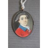 A George III oval portrait miniature pendant, circa 1790, a gentleman, bust length,