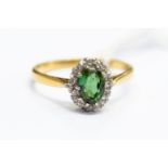 A green tourmaline and diamond cluster,