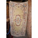 cream rug with floral patterns