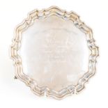 Masonic Interest: An Elizabeth II silver salver, pie crust rim on three scroll feet,