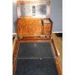 An oak travelling writing slope / desk incorporating original ink wells, letter rack,