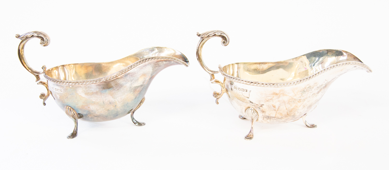 A pair of late Victorian plain silver sauceboats, gadroon rim,