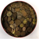 A circular tin of various coins