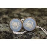 A pair of Wedgwood blue jasper cuff links, each with a white relief of a crab,