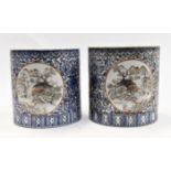 A pair of Chinese polychrome porcelain brush pots,