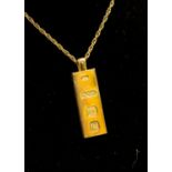 A 9ct gold ingot pendant on a 9ct gold chain, total gross weight approx 22.