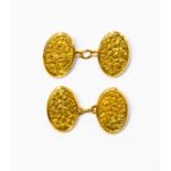 A pair of 18ct gold cufflinks with engraved foliate pattern, total gross weight approx 4.