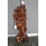 Early 20th Century Chinese carved fruitwood male figure table lamp,