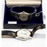 A gentlemans boxed stainless steel quartz wrist watch, with stainless steel strap,