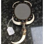 An early 20th century Austro-Hungarian oval gilt metal mirror,