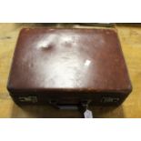 A brown leather briefcase,