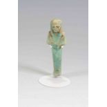 Egyptian Faience Shabti Third Intermediate Period, Circa 900 BC. The figure is depicted in mummiform