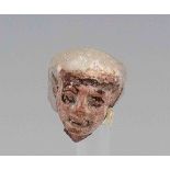 Egyptian Polychrome shabti head. Late 2nd Millennium B.C A head of a painted polychrome shabti