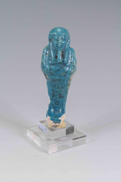 Egyptian Faience Shabti Ptolemaic Period, C. 300-32 BC. An upper section of a shabti figure with
