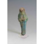 Egyptian Faience Shabti Third Intermediate Period, C. 730 BC. A bright blue faience shabti figure