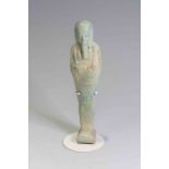 Egyptian Faience Shabti Late Dynastic Period, C. 525 B.C. A pale green glazed composite shabti