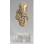 Egyptian Faience Shabti Third Intermediate Period, Circa 900 BC. The figure is depicted ishowing the