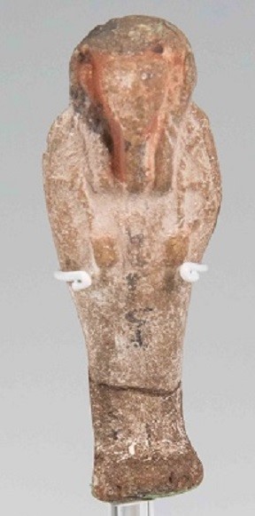 Egyptian moulded pottery shabti figure with some painted decoration.