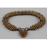 A 9ct. rose gold panther chain bracelet, impressed "9c", with 9ct. gold heart padlock clasp,