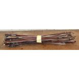 a collection of antique violin bows