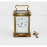 **REOFFER IN APR LONDON 20/40**A late 19th brass carriage clock with full length enamel dial and