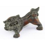 Japanese Meiji Period (1868-1912) carved boxwood Shi Shi netsuke, carved in typical pose, 6 cm long