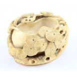 **REOFFER IN APR LONDON 120/180**A Chinese Qing Dynasty carved ivory brush washer, carved as a lotus